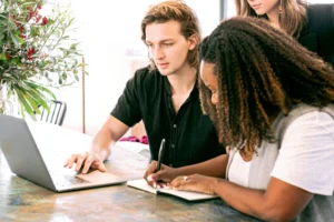 A group of three practicing active learning as they study from their computer