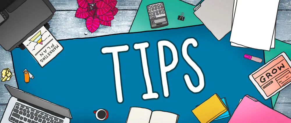 A table with study materials and "TIPS" boldly written on a notebook at the center to illustrate "Effective Study Tips"